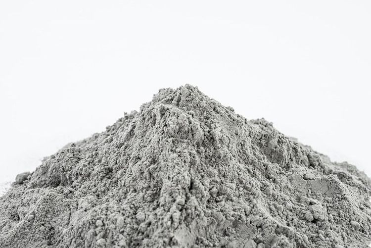up_of_grey_cement_powder_pile_on_white_background