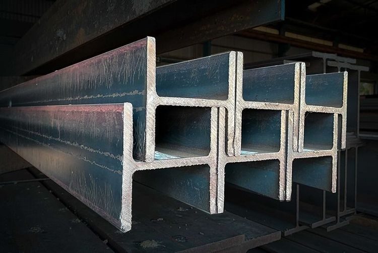 Products_of_the_metal_structure_factory,_I-beam_steel,_H-beam_welding,_Selective_Focus,_raw_materials_used_in_building_construction._Steel_floor_beams_in_piles._