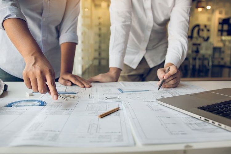 Engineers_are_helping_to_design_work_on_blueprints_and_collaborate_on_structural_analyzing_of_project_types.