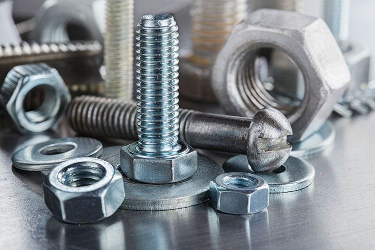 set_of_different_nuts,_bolts,_screws,_washers_and_drill_bits,thread_tap_and_mill_cutters_on_steel_plate_background._Locksmithing_deal.