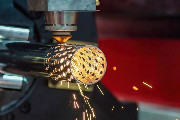 The_fiber_laser_cutting_machine_cutting_machine_cut_the_stainless_steel_tube._The_technology_sheet_metal_manufacturing_process_by_laser_cutting_machine