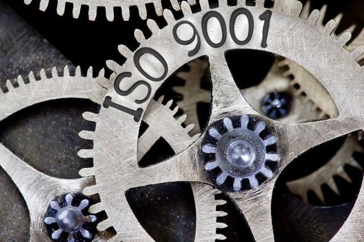 Macro_photo_of_tooth_wheel_mechanism_with_ISO_9001