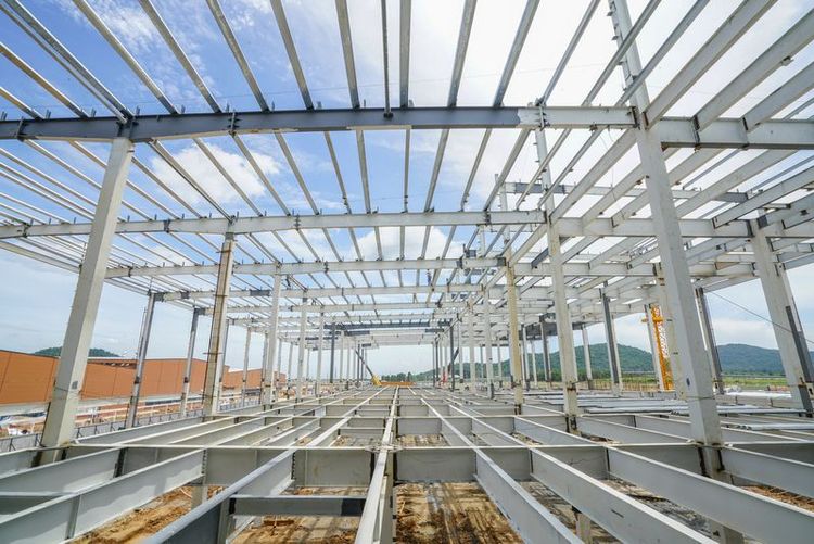 Various_components_such_as_columns,_rafters,_purlins,_girts,_and_panels_for_steel_erection_of_metal_building.