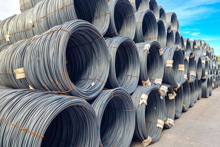 Coils_of_steel_wire_rod_on_truck_trailer_at_industrial_zone._Truck_receive_steel_wire_rod_from_warehouse_container_unstuffing_area.