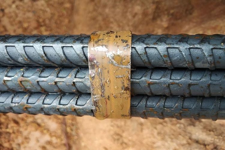 tmt_bars_bound_with_yellow_tape_showing_ribbed_surface_for_concrete_bonding