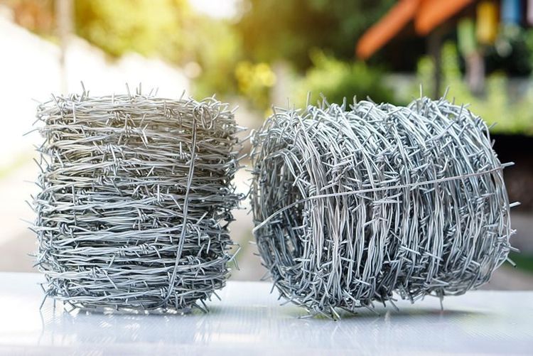 Rolls_of_barbed_wire._Barbed_wire_is_used_for_make_fences_,_secure_property_and_make_border_to_show_the_territory_of_area.