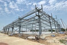 What are the advantages of steel in seismic-resistant industrial construction?